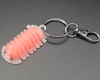 Pink keychain with a metal ring on a gray background