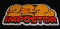 Sticker with three yellow ducks and the word 'IMPOSTOR' on a black background