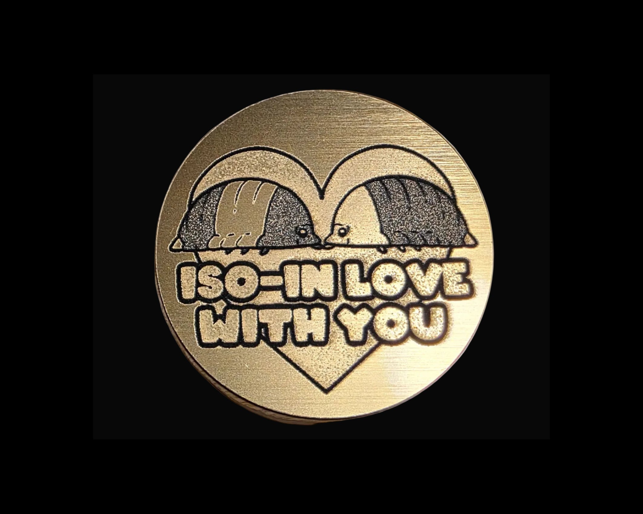 Bronze magnetic bottle opener with three duck-like characters and the word 'IMPOSTOR' on a textured surface