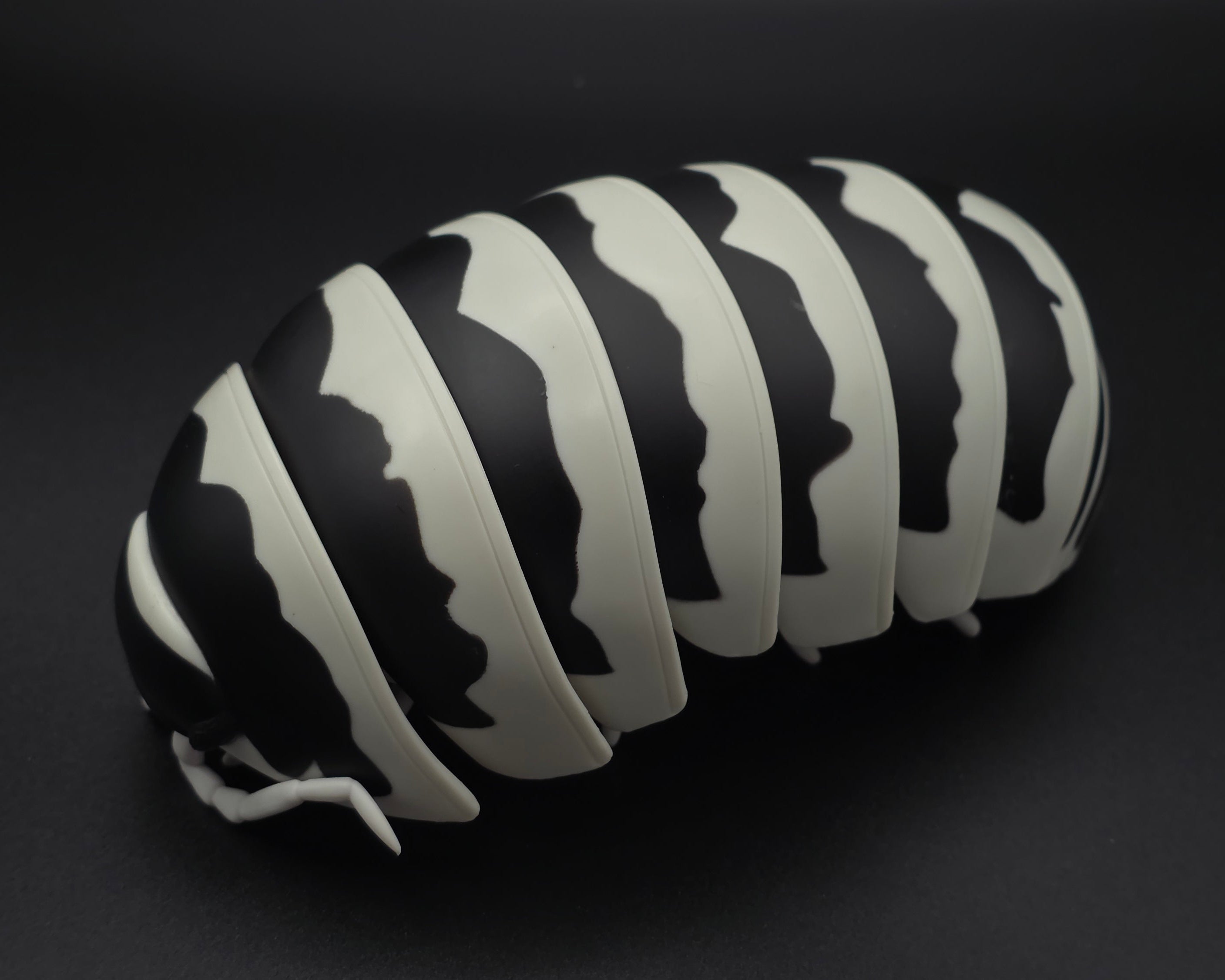A side view of a zebra gashapon